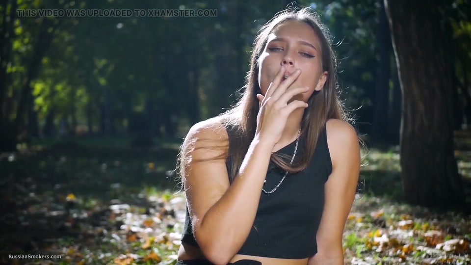 Seductive Russian Beauty Smoking Cigarette in Studio