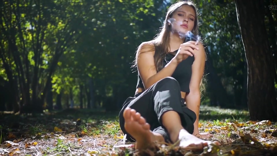 Seductive Russian Beauty Smoking Cigarette in Studio screenshot 2