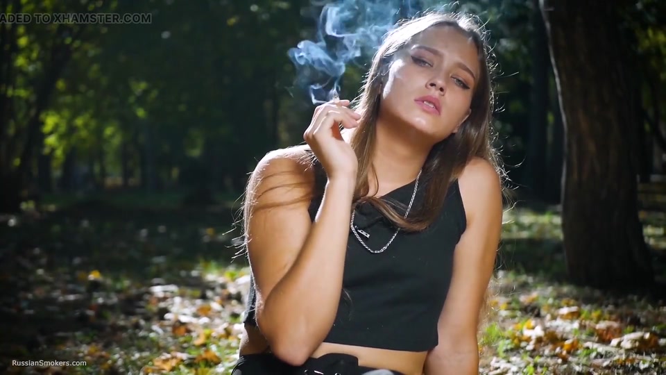 Seductive Russian Beauty Smoking Cigarette in Studio screenshot 3