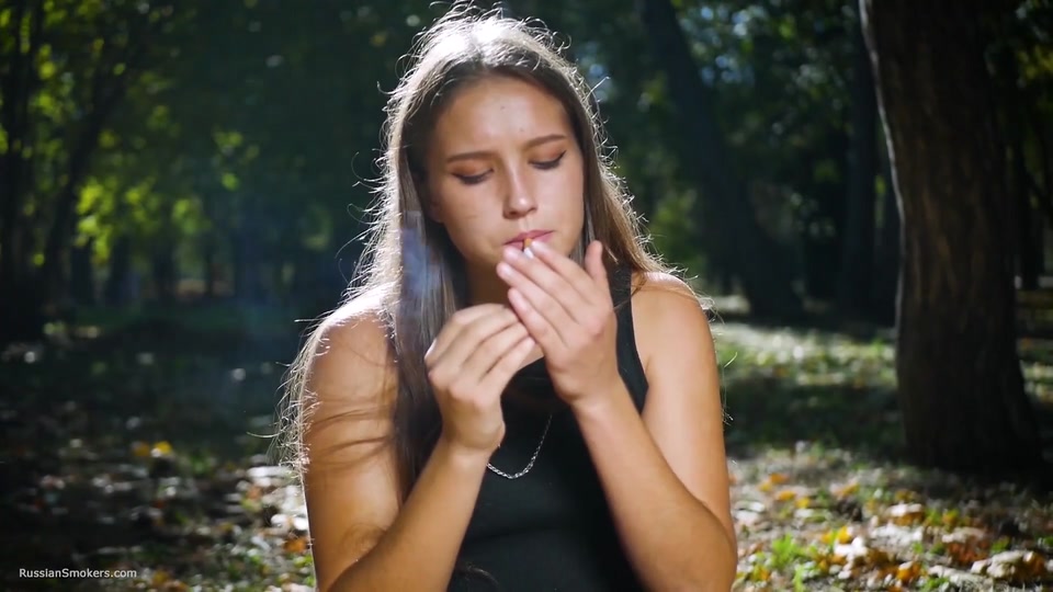 Seductive Russian Beauty Smoking Cigarette in Studio screenshot 6